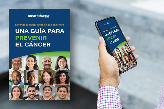 A close-up image of a person holding a smartphone. The screen has an image of the Prevent Cancer Foundation Guide to Preventing Cancer in Spanish on the screen.